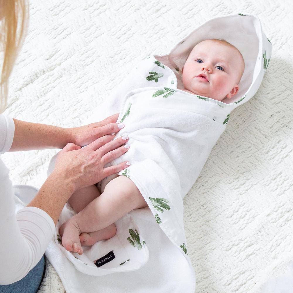 Baby holding online towel